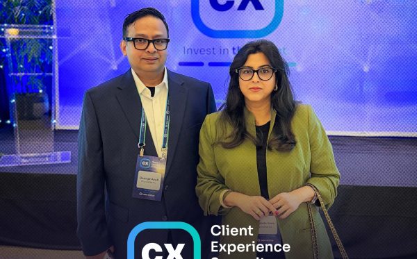 George Ayub and Dr. Soeta Islam with the CX Summit 2026 Platinum Sponsor banner